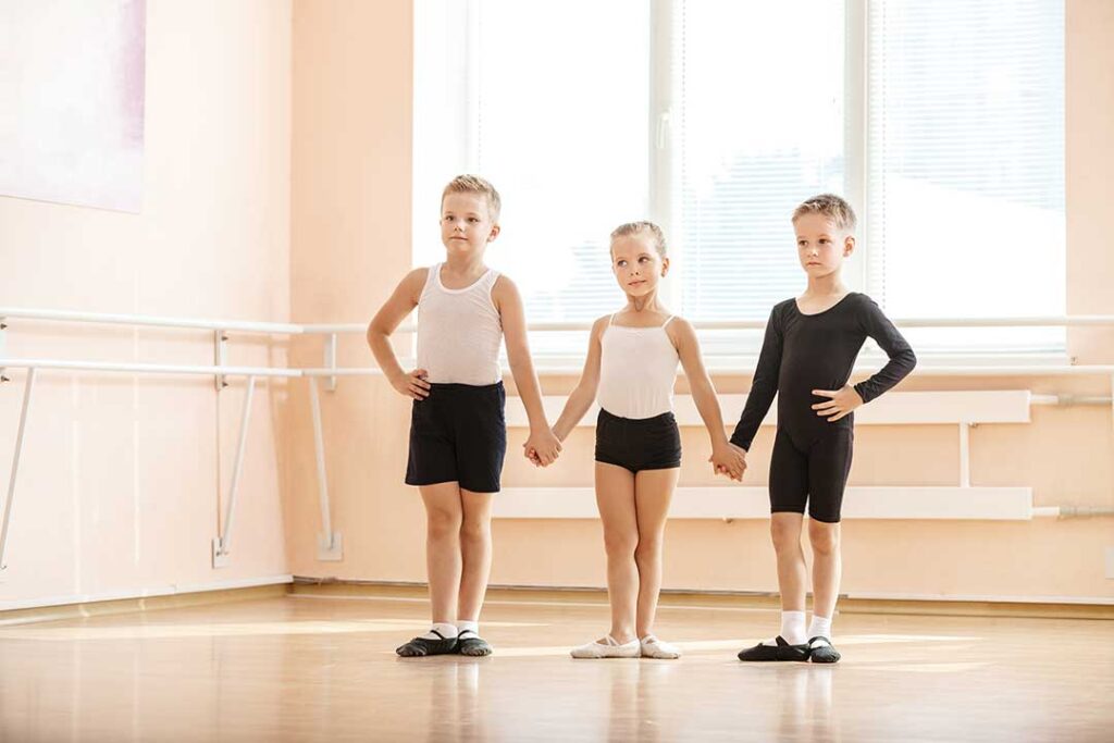 A diverse group of people dancing together in a bright, spacious studio.