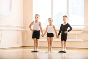 A diverse group of people dancing together in a bright, spacious studio.